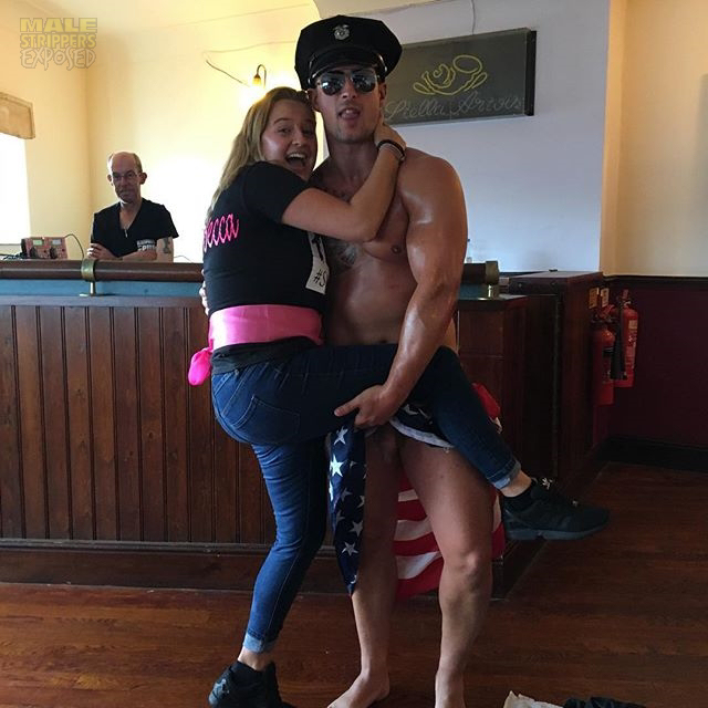 A British male stripper posing naked with a woman at a party
