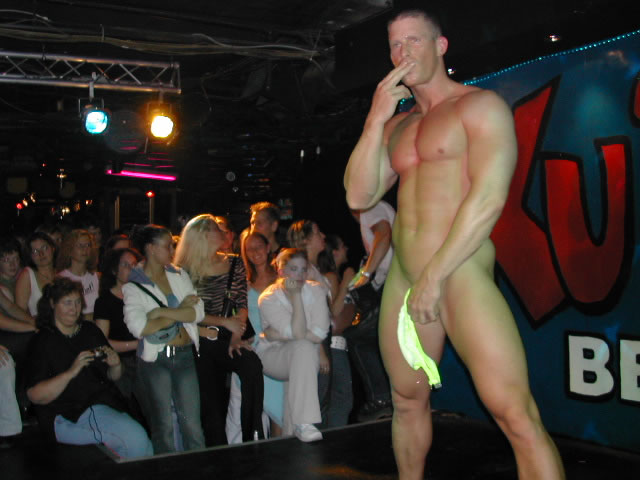 A naked male stripper showing his penis