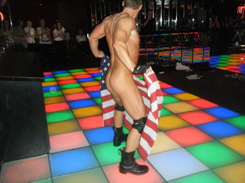 A male stripper from a male revue group showing his dick